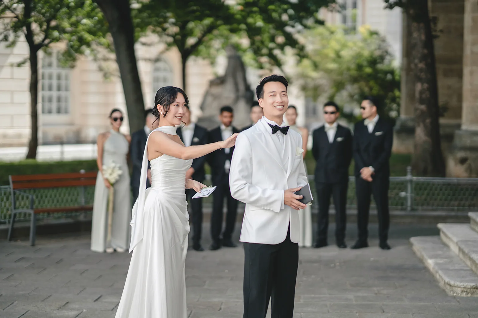 Jiamin and Anthony just before their first look, standing back to back